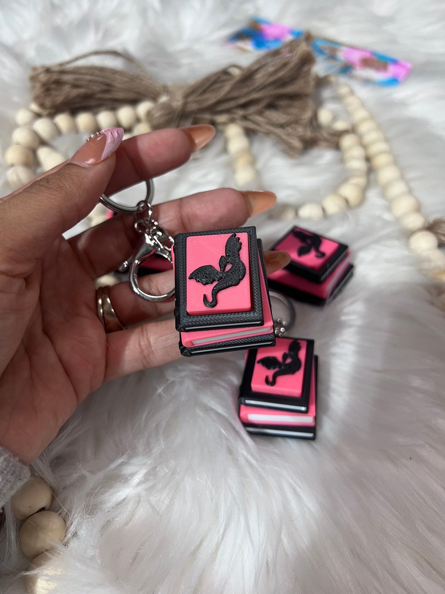 Dragon book lover clicker keychain