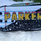 Pencil case with 'PARKER' printed on it against a white background